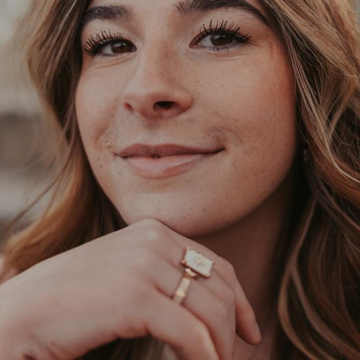 Kaveri Mehta, Lead Design Curator at Holistic Living Framework, reviewing corporate floral arrangements